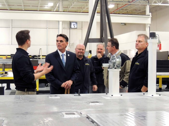 Mark Hackel discussing local business with the Baker Industries team