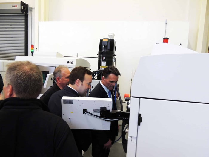 Mark Hackel observing DMLS 3D printing during a tour of Baker Industries in Macomb, Michigan