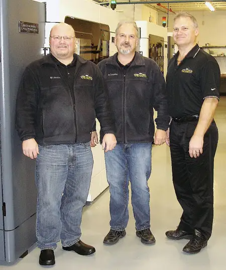 Baker Aerospace founders Scott (left) and Kevin Baker (right) with new Additive and Molding Tooling Director Mike Misener in the company's 3-D printing lab.